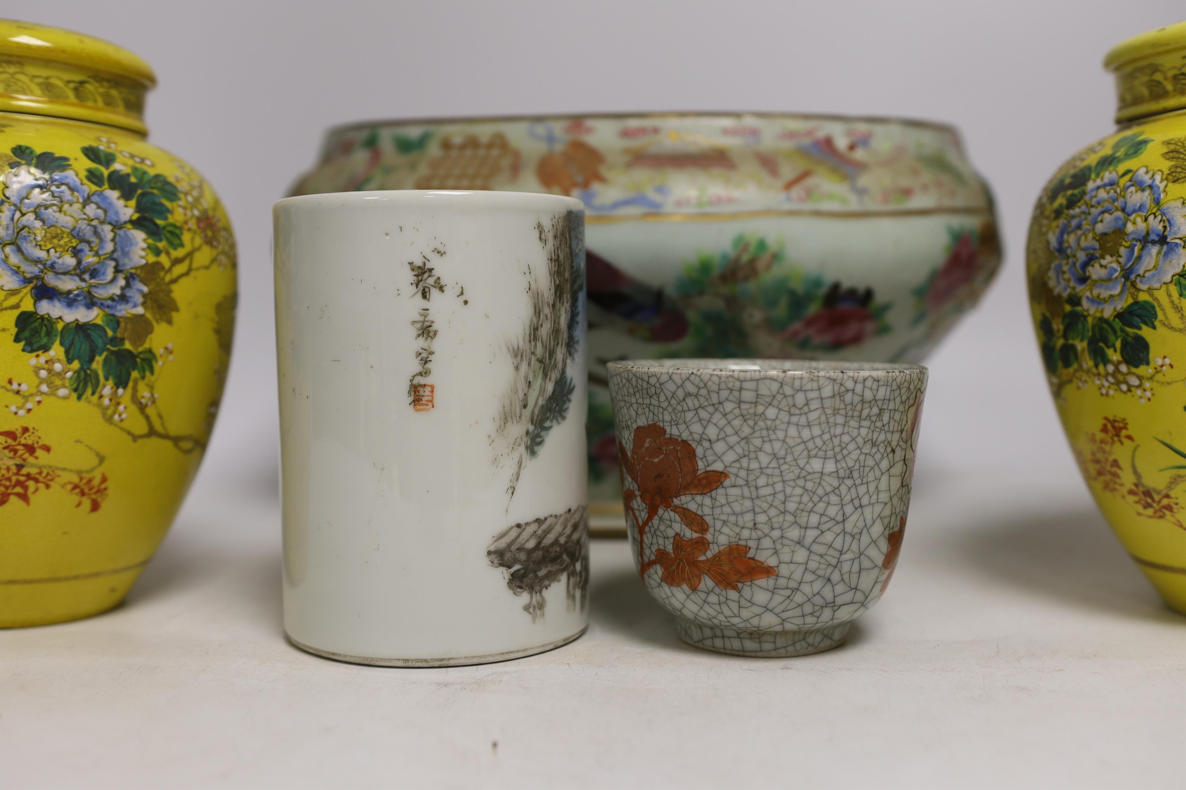 A 19th century Chinese famille rose tureen (lacking cover), a bronze mirror, a brush pot, a crackle glazed teabowl and a pair of Japanese yellow glazed satsuma jars and covers, tallest 18cm (6)